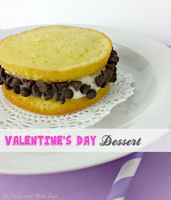 chocolate chip whoopie pies on white plate with purple backdrop