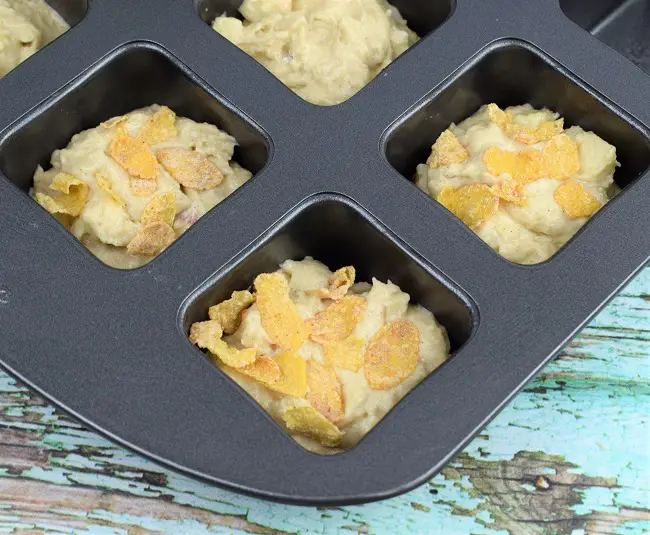 apple muffins cinnamon frosted flakes in baking pan